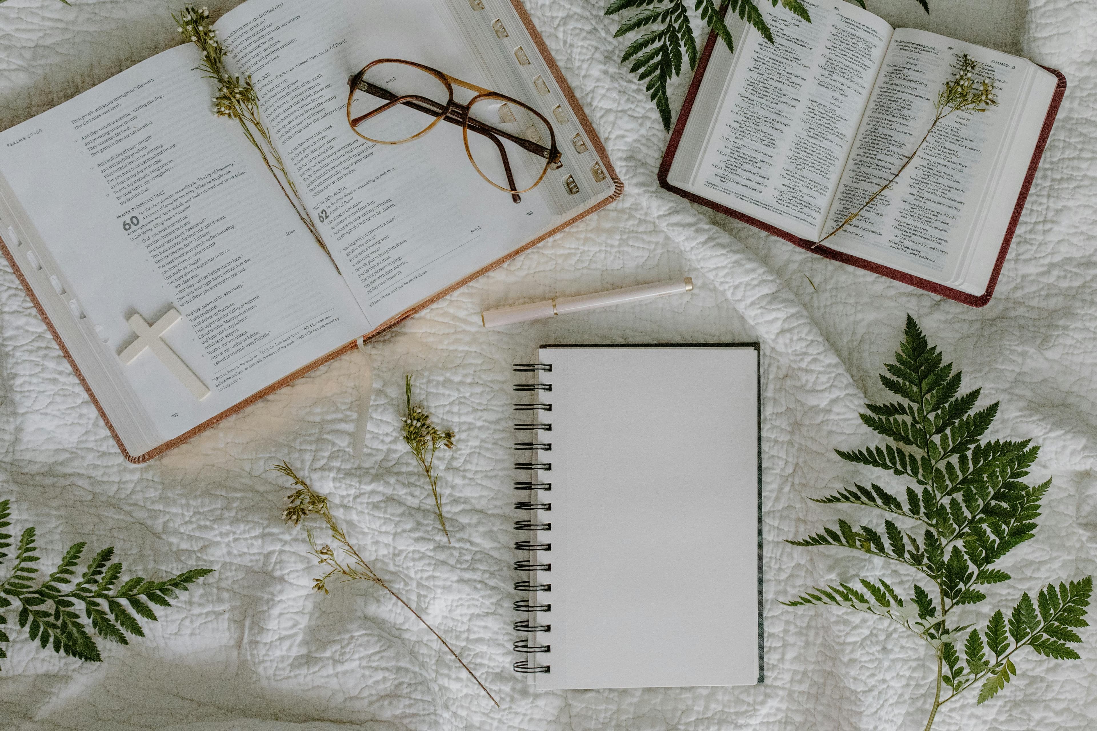 Open Bible and study materials on a desk
